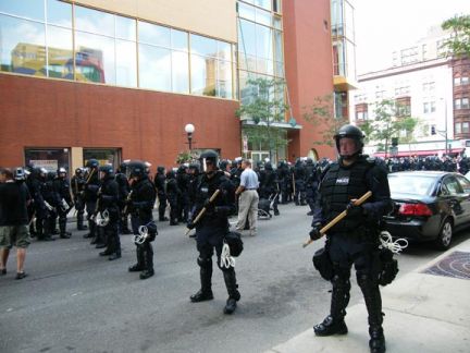 Line of Riot police 
keeping people away from marching