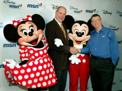 Bill Gates, (R) Microsoft chairman and chief software architect and Michael Eisner, chairman and CEO of The Walt Disney Company pose with Micky and Minnie Mouse at the launch of Microsoft's MSN 8 in New York City, October 24, 2002. Microsoft and Disney have joined together to deliver Disney on MSN, a co-branded Internet service that combines the new MSN 8 software and Disney content. Photo by Jeff Chistensen