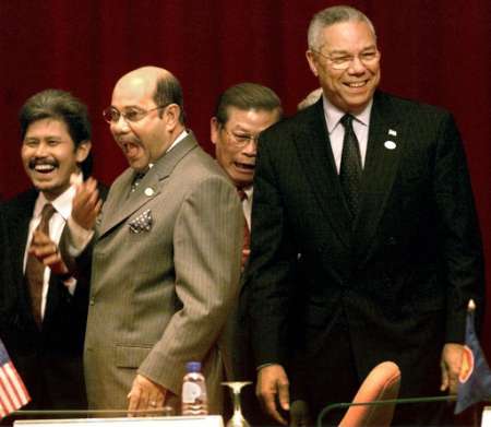 U.S. Secretary of State Colin Powell (R) laughs at a joke by Malaysian Foreign Minister Syed Hamid Albar (2nd L) as Brunei's Foreign Minister Prince Mohamed Bolkiah (L) and Laos Foreign Minister Somsavat Lengsavad join in after Southeast Asia signed an anti-terror pact with the United States in Bandar Seri Begawan August 1, 2002. Foreign ministers from the Association of Southeast Asian Nations (ASEAN) vowed to cooperate with the United States on counter terrorism operations, sharing information, blocking terrorist funds and clamping down on forged travel documents. Photo by Bazuki Muhammad