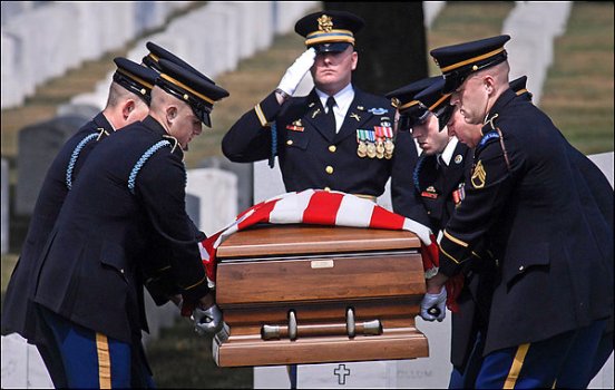 An Army honor 
guard carries Darrell C. Lewis' coffin to the grave site in Arlington 
National Cemetery