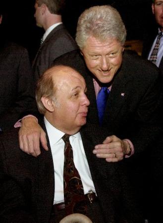 Former President Bill Clinton, right, laughs while talking with former White House press secretary James Brady during the release party for the personal 
memoir of Brady's wife, Sarah Brady, in New York Tuesday, March 26, 2002. Photo by Matt Moyer