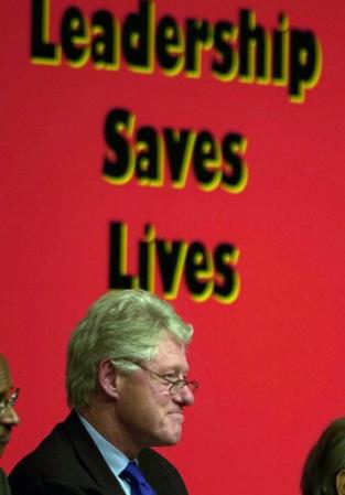 Former U.S. President Bill Clinton smiles during a conference on AIDS at the XIV International AIDS conference in Barcelona, Spain, Thursday, July 11, 2002. Photo by Denis Doyle