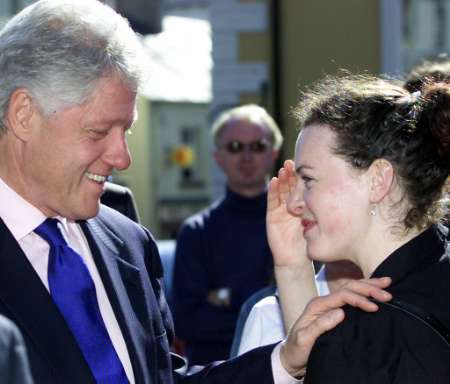 Former U.S. President Bill Clinton meets local people during a visit to Enniskillen, Northern Ireland, June 5, 2002. He was opening a peace center in the town where an IRA bomb killed 11 people in 1987. Photo by Paul McErlane