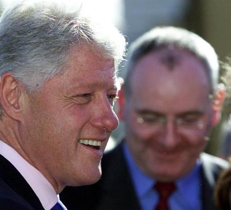 Former President Bill Clinton, left, laughs with Northern Ireland Deputy First Minister Mark Durkin during a short walkabout in Enniskillen, Northern Ireland, Wednesday, June 5, 2002. Photo by Peter Morrison