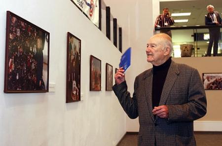 Dick Kelley, former President Bill Clinton's stepfather, views photographs Monday, March 11, 2002, at the Hot Springs, Ark., Convention Center made by White House photographers. The exhibit, scheduled to run six months, is made up of 71 photographs that hung on the walls of the White House during Clinton's presidency. Photo by Danny Johnston