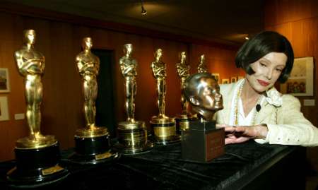 Audrey Wilder, wife of late five-time Academy Award winning writer-director Billy Wilder, views his statuettes as well as his Irving G. Thalberg Award prior to a screening of Wilder's ''The Lost Weekend'' September 3, 2002 in Beverly Hills, California. Wilder won two Oscars for ''The Lost Weekend,'' three for ''The Apartment,'' and another for ''Sunset Boulevard.'' Mrs. Wilder placed the statuettes back in the care of the Academy of Motion Picture Arts and Sciences. Photo by Robert Galbraith