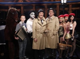 In this Nov. 29, 2010 photo provided by CBS, Craig Ferguson, fourth from right, stands next to Jacques Essebag, the host of 'Ce Soir Avec Arthur', fifth from right, on the set of the 'Late Late Show' in Los Angeles. Ferguson uncorked an on-air rant last week after finding out that portions of his show were being hijacked and copied by the French TV host. But then on Monday, Ferguson buried the hatchet and introduced America to the boyish cutup known in France simply as Arthur, as he made a surprise guest appearance.   Photo by Sonja Flemming