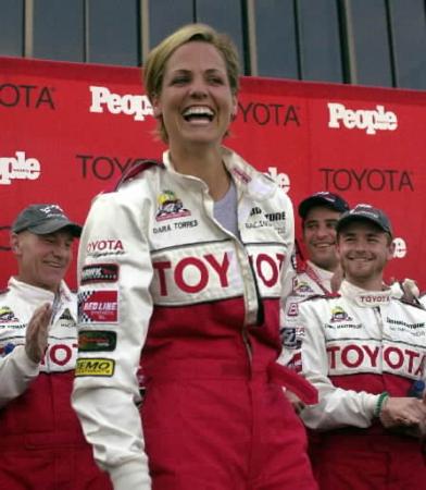 Olympic swimmer Dara Torres is all smiles after posting the fastest qualifying time among the celebrities Friday, April 12, 2002, for Saturday's pro-celebrity race. Photo by Jeff Gritchen