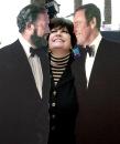 Jo Anne Worley clowns with cardboard cutouts of show's stars Dan Rowan, left, and Dick Martin