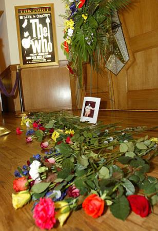 A row of flowers and a picture of The Who's bass guitarist John Entwistle adorn a small memorial area just outside The Joint concert venue at The Hard Rock Hotel and Casino, Thursday, June 27, 2002, in Las Vegas. Entwistle died in his sleep Thursday while staying at The Hard Rock as the band was expected to kick off their North American tour two day's later. Photo by Eric Jamison