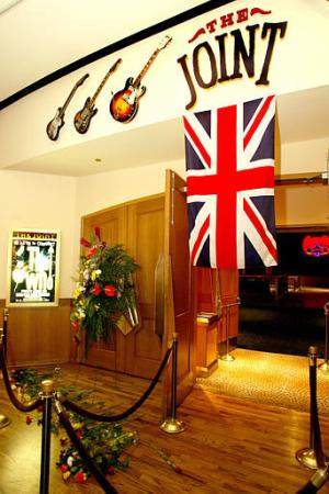 A row of flowers and a British flag lie at the entrance of The Joint concert venue at The Hard Rock Hotel and Casino in memory of The Who's bass guitarist John Entwistle, Thursday, June 27, 2002, in Las Vegas. Entwistle reportedly died in his sleep Thursday while staying at The Hard Rock. Photo by Eric Jamison