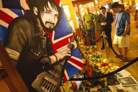 A painting of bassist John Entwistle of The Who, who was found dead Thursday in his hotel room, stands over a memorial outside The Joint nightclub at the Hard Rock hotel and casino in Las Vegas on Friday, June 28, 2002. Photo by Sam Morris