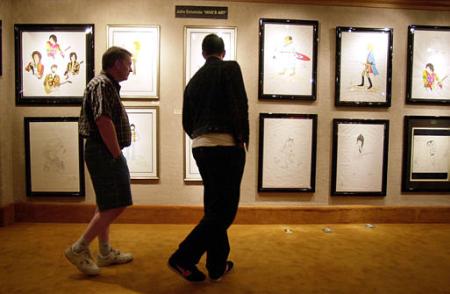 Mark, left, and Joe McGlade, of Northern Ireland, look at artwork by John Entwistle, the bassist for the Who, Thursday, July 27, 2002 at the Grammy's Art of Music Gallery at the Aladdin Hotel and Casino in Las Vegas. Entwistle was to have been at the opening of his art show. Photo by Joe Cavaretta