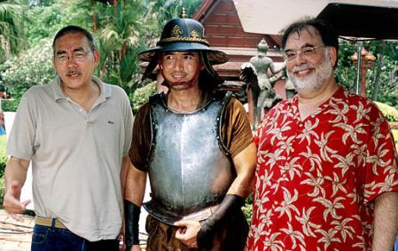 Movie Director Francis Ford Coppola, right, actor Chatchai Plengpanich, middle, and Thai director and Prince 
Chatrichalerm Yukol pose for photographs Monday, March 11, 2002 on the set in Ayuthaya. Coppola is in Thailand 
to help edit the new version of ''Suriyothai''. The film will be shown in the Thai language with English subtitles. Photo by Mick Elmore