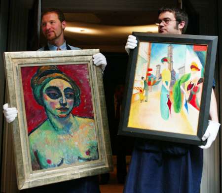 A painting by German artists Alexej von Jawlensky (1864-1941) called Halbakt (Half-Nude) which was painted in 1912 (left) and an August Macke (1887-1914) work called Zwei Frauen vor dem Hutladen (Two Women in front of a Hat Shop) (R) are shown at Sotheby's in London ahead of an auction in October 2002 of the Beck Collection of German expressionist and Modern Art, where they are expected to fetch US$1.4 -1.8 million and US$ 2.3-3.1 million respectively, July 18, 2002. The painting by Jawlensky, described by Sotheby's director Helena Newman as one of the best in the collection, was at one stage in its life found in the studio of artist Josef Eberz blocking a hole in the ceiling. The Beck family, which ran a successful central heating business, supported many artists whose work was banned by the Nazi regime and labeled ''degenerate''. Photo by Stephen Hird