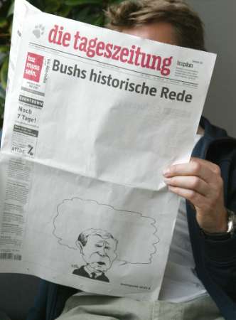 A man reads a copy of the left-leaning German newspaper ''Tageszeitung'' in Berlin May 24, 2002, one day after U.S. President George W. Bush gave a key note speech in the German lower house of parliament Bundestag. The front page of the Friday edition is almost completely blank and shows a cartoon of Bush with an empty speech bubble under the headline ''Bush's historic speech''. Photo by Alexandra Winkler