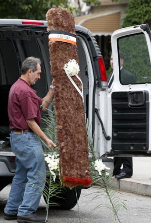 A floral arrangement in the form of a Cohiba cigar arrives for the wake of former mob boss John Gotti at the Papavero Funeral Home, in the Queens borough of New York. Photo by Robert Spencer