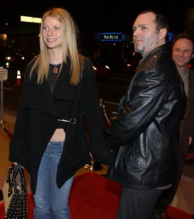 Actress Gwyneth Paltrow, left, arrives with Madonna's brother, Christopher Ciccone, at the premiere of the Mexican film ''Y Tu Mama Tambien'' in Los Angeles, Tuesday, March 12, 2002. Photo by Chris Pizzello