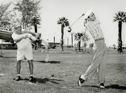 Harpo Marx and Joey Bishop play golf at the Desert Inn Golf Course in Las Vegas, Nevada,  May 29, 1954