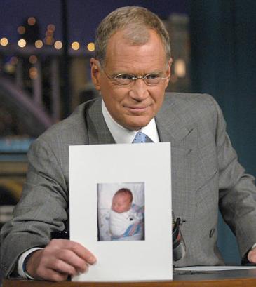 David Letterman holds a photo of his new son, Harry Joseph Letterman, during the taping of 'The Late Show with David Letterman,' Tuesday, Nov. 4, 2003, in New York. Letterman announced that his girlfriend, Regina Lasko, delivered a baby boy late Monday night. He weighed in at 9 pounds, 11 ounces and is 21 inches long.  Photo by JP Filo