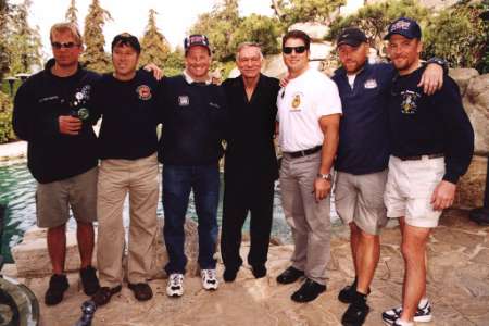 New York City Firefighters from Engine 33 Ladder 9 in Greenwich Village at the Playboy Mansion - (L-R) Matt Hornung, Ralph Perricelli, Dan 'Pappy' Rowan, Hugh Hefner, Sal Princiotta, Gerard Dolan, Drew Robb - Photo by Elayne Lodge