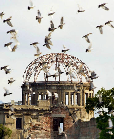 Doves fly over Hiroshima's Peace Memorial Park during a ceremony to mark the anniversary of the atomic bombing of the city on August 6. Photo by Eriko Sugita