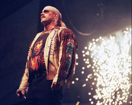 Fireworks go off behind Minnesota Gov. Jesse Ventura, who skipped the formal attire by dressing as 