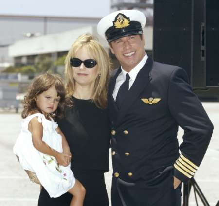 Actor John Travolta, wife Kelly Preston and their two year old daughter Ella Bleu pose at a news conference at Los Angeles International airport, June 24, 2002. Photo by Fred Prouser