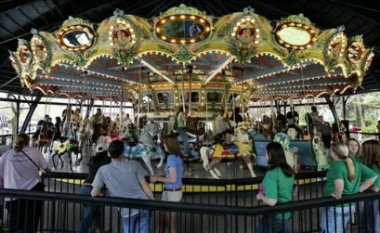 The 1926 wooden carousel at Kennywood Park in West Mifflin, Pa., twirls to life for the first time Friday, May 6. 2005, since being painstakenly disassembled this winter and cleaned and painted for the first time in its 79 year history.  Photo by Gene J. Puskar