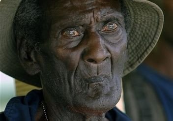 This image provided by the US Navy shows Eroni 'Aaron' Kumana, waiting to meet the Secretary of the Navy Donald C. Winter at the Gizo soccer field on the Solomon Islands Wednesday Aug. 22, 2007. Eroni is credited with the rescue of Lt. John F. Kennedy, and the rest of PT-109's crew following the ship's collision with the Japanese destroyer Amagiri near Plum Pudding Island on August 2, 1943. Six decades after Aaron Kumana helped rescue young U.S. naval officer John F. Kennedy from Japanese capture in 1943, the U.S. Navy officially recognized its debt to the Solomon Islander, who for years was believed dead and not honored. Photo by  Shawn P. Eklund