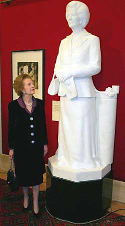 Former British Prime Minister Margaret Thatcher unveils an 8-foot marble statue of herself by artist Neil Simmons in London May 21, 2002. Photo by Stephen Hird