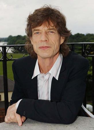 Rolling Stone Mick Jagger poses at his home in southwest London, Friday, June 14, 2002, before it was announced that he has received a knighthood in the Queen's Birthday Honours List. Photo by MJ Kim