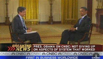 This image made from video released by CNBC, shows President Barack Obama smacking a fly dead during an interview with CNBC correspondent John Harwood, left, in the White House on Tuesday June 16, 2009 in Washington.