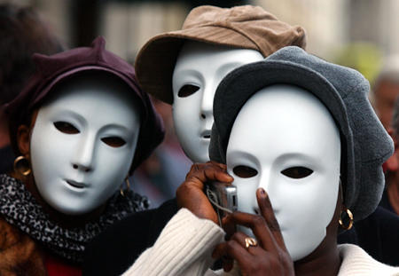 Parisian prostitutes wearing masks so as not to be identified, demonstrate in front of France's Senate, November 5, 2002 where senators were discussing Interior Minister Nicholas Sarkozy's new bill on security. If adopted, prostitutes could face prison terms. The move is an attempt to close a loophole in French law under which prostitution is legal, obliging them to pay income tax, but the act of soliciting is illegal. Photo by Xavier Lhospice