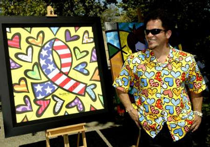 Brazilian artist Romero Britto displays a piece of art titled 'What More Can I Give,' created following the attacks on the United States two years ago, outside reclusive pop star Michael Jackson's Neverland ranch in Los Olivos, California September 13, 2003. Prints of the artwork were given to those attending a charity event at the ranch, which also served as a tribute to Britto's art and as part of Jackson's 45th birthday celebration. The event cost $5,000 per person with each receiving a $1,000 gift bag. The event marked the first time the ranch was open to the public. Photo by Robert Galbraith