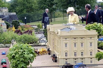 Britain's Queen Elizabeth II passes a model of Buckingham Palace at Legoland in Windsor, England, Tuesday, June 10 2003. The Queen, along with other members of the royal family were celebrating a day of British Tourism. The queen's visit to the theme park included a walk through Mini-Land viewing models of central London. Photo by Dave Caulkin