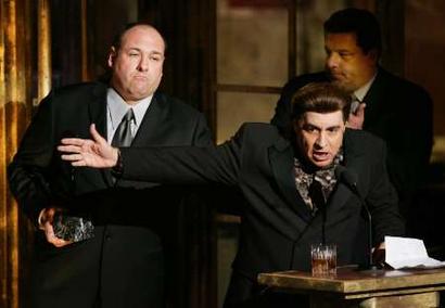 Musician and actor Steven Van Zandt (C) appears as his character 'Silvio,' from the HBO original series 'The Sopranos,' as he inducts Frank Barsalona into the Rock and Roll Hall of Fame at the Waldorf Astoria Hotel in New York, March 14, 2005. 'Sopranos' co-stars Vincent Pastore (R-Rear) and James Galdofini (L).    Photo by Mike Segar