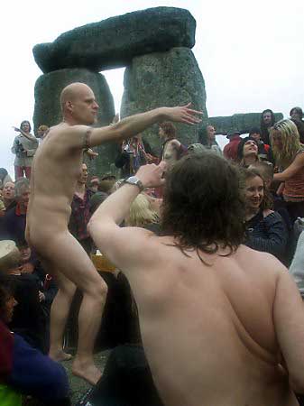 Naked revelers dance in the stones of Stonehenge on the day of the summer solstice in Wiltshire, June 21, 2002. Photo by Darren Staples