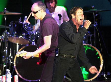 Pete Townshend, left, and Roger Daltrey, right, of The Who perform at the Hollywood Bowl Monday, July 1, 2002, in Los Angeles. Daltrey dedicated the band's performance to their late band member, John Entwistle. Photo by Krista Niles