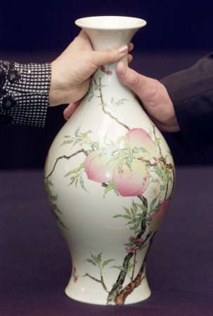 A famille-rose enameled vase with peach patterns from the Yongzheng period (1723-1735) of China's Qing Dynasty, which was sold for HK$41,500,000 (US$5.36 million) at a Sotheby's auction in Hong Kong May 7, 2002. Photo by Bobby Yip