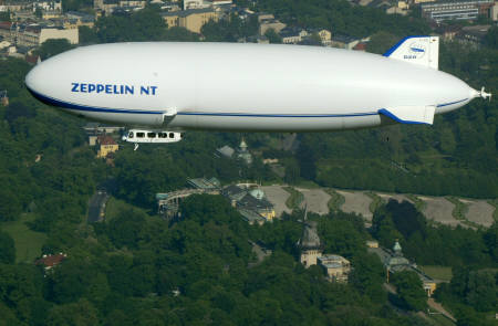 A Zeppelin NT airship is seen over the gardens of Sanssouci Castle in Potsdam near Berlin May 17, 2002. Photo by Arnd Wiegmann